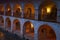Fragment of the gallery of the building of an ancient caravanserai in the evening twilight. Sheki, Azerbaijan