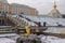 A fragment of the Grand Palace and the Samson Fountain on a frosty November day. The first snow