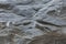 Fragment of gray rock surface. Durable building and decorative materials. Background. Space for text