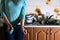 Fragment of the handcuffed female body at the kitchen counter, f