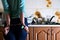 Fragment of the handcuffed female body at the kitchen counter, f