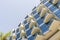 A fragment of the hotel building, windows and balconies against the sky. design and architecture, details of buildings