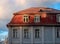 Fragment of a house with a beautiful tiled roof