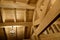 Fragment of a house made of wooden beams. Roof view with chandelier. Construction of frame houses from environmentally friendly