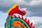 A fragment of an inflatable trampoline slide, a dragon on the background of a stormy sky, danger to children