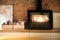 Fragment of interior loft. Burning fireplace. Picture Frames and