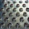 Fragment of a metal grater. Grater for vegetables. Kitchen accessories. Tools for cooking. Snapshot of a stainless steel grater. T
