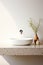 Fragment of minimalist bathroom with white wall, Terrazzo stone countertop, white sink, wall mounted faucet, elegant