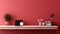 Fragment of minimalist monochrome interior of modern office room in pastel carmine red and pink tones. Large desktop