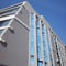 fragment of a modern apartment building. the concept of providing housing, buying an apartment or renting out. blue sky.