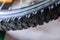 Fragment of a mountain bike tire tire. Macro. Shooting from the bottom up. Soft focus.