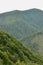 Fragment of the mountainous terrain in the Carpathians, Ukraine. The forest is forgiven by the reliefs of the Carpathian Mountains