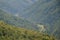 Fragment of the mountainous terrain in the Carpathians, Ukraine. The forest is forgiven by the reliefs of the Carpathian Mountains