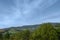 Fragment of the mountainous terrain in the Carpathians, Ukraine. The forest is forgiven by the reliefs of the Carpathian Mountains