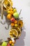 Fragment of a New Year`s wreath decorated with cinnamon, anise, lemon, pine cones and small artificial fruits