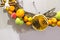 Fragment of a New Year`s wreath decorated with cinnamon, anise, lemon, pine cones and small artificial fruits