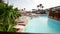 Fragment of nice luxury resort hotel with beautiful swimming pool