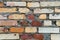 A fragment of an old brick wall in orange red and yellow colors.Texture, background.