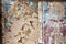 Fragment of an old fresco with the faces of saints in the dilapidated Montenegrin church.