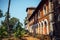 Fragment of an old red brick building with windows and a tower. Historical buildings, architecture of India of colonial times