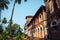 Fragment of an old red brick building with windows and a tower. Historical buildings, architecture of India of colonial times