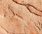 Fragment of an old wall made of red clay. Abstract old background