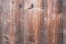 Fragment of old wooden surface, natural color formed by time, wooden doors, cracks, knuckles, nails, textures and backgrounds, spa