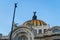 Fragment of Palacio de Bella Artes in Mexico city. View of dome with blue sky. Travel, architecture photo. Background