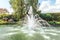 Fragment of the park in Mezhigiri near Kiev. A small fountain on the lake.