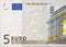 Fragment part of 5 euro banknote close-up with small brown details