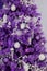 fragment of a purple Christmas tree decorated with balls. Christmas and New Year holidays