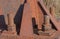 Fragment of a rusty iron construction with bolts and nuts