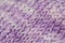 Fragment of seamless knitted patterns with range of purple colors