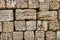 Fragment of shell limestone brick wall