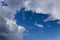 Fragment of sky with cirrus, cumulus and rain clouds