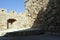 Fragment strongly weathered medieval castle wall on the island of Rhodes in Greece