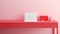 Fragment of stylish minimalist monochrome interior of modern office room in pastel carmine red and pink tones. Large