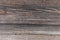 Fragment of the texture of an old corrugated wooden wall. Texture.