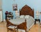 Fragment of view of old vintage gorgeous wooden bed and other accessories