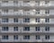 A fragment of the wall of a residential building under construction. Same windows and balconies