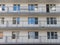 A fragment of the wall of a residential building under construction. Windows and balconies