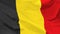 Fragment of a waving flag of the Kingdom of Belgium in the form of background