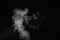 Fragment of white hot curly steam smoke isolated on a black background, close-up. Create mystical photos. Abstract