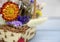 Fragment of a wicker basket with bright dried flowers