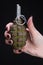 fragmentation grenade in woman hand