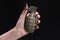 fragmentation grenade in woman hand