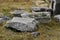 Fragments of ancient buildings, ruins of the ancient city of Hierapolis. Stone blocks with traces of stone machining