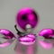 Fragments of a broken purple Christmas-tree ball lie on a mirror