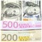 Fragments of hundred-dollar banconotes and banknotes of two hundred and five hundred euros