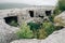 Fragments of rooms carved into the rock in the mountain town of Eski-Kermen.